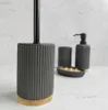 A bathroom accessory set on a marble-like surface. Anteprima dell’immagine prodotto