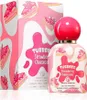A perfume bottle and its box, both decorated with strawberry cheesecake graphics. Podgląd zdjęcia produktu