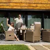 A couple enjoying themselves on a patio with outdoor furniture. Náhled obrázku produktu