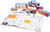 An open book with instructions and various small boxes and items for an experiment. Anteprima dell’immagine prodotto