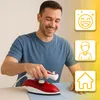 A man is ironing a piece of fabric with a red and white travel iron. There are three yellow icons on the right side of the image: a smiling face, a person icon, and a house icon. Produktbild-Vorschau