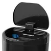 Close-up view of the top of a black sensor trash can with the lid open, showing the sensor area with blue wavy lines indicating motion detection. Anteprima dell’immagine prodotto
