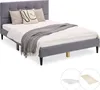 A bed with bedding and pillows, shown from a diagonal angle against a white background. Two smaller circular insets show a mattress and a wooden slat base. Náhled obrázku produktu
