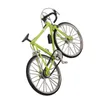 A miniature green bicycle model is displayed against a white background. Produktbild-Vorschau