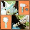 A collage of four images showing a child playing with a toy hair salon set. Voir les images du produit