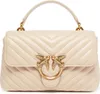 A studio shot of a beige handbag. Voir les images du produit