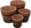 A set of four wooden planters of varying sizes, arranged in a cluster. Anteprima dell’immagine prodotto