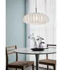 A dining table with chairs and a pendant light. Podgląd zdjęcia produktu