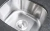 A close-up view of a stainless steel sink with a drain. Produktbild-Vorschau