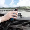 A hand is placing a smartphone onto a magnetic car phone mount on a car dashboard. Náhled obrázku produktu