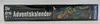 The side view of a boxed board game with a dinosaur illustration. Produktbild-Vorschau