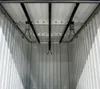 Interior view of a metal storage shed, showing the ceiling with a bike rack system. Produktbild-Vorschau