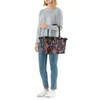 A person holding a shopping bag. Produktbild-Vorschau