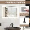 An illuminated bathroom mirror with installation instructions. Náhled obrázku produktu