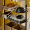Detailansicht der Drahtkörbe des SoBuy Garderobenständers KLS04-SCH mit Kleidung und Helm Produktbild-Vorschau