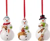 Three ceramic snowman ornaments hanging from red ribbons against a white background. Podgląd zdjęcia produktu