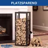 A metal firewood rack filled with logs next to a fireplace. Náhľad obrázku produktu