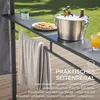 Outdoor scene with a bar/shelving unit set up on a wooden deck, featuring drinks, snacks, and a towel. Náhled obrázku produktu