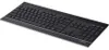 A black wireless keyboard with a silver trim is shown from a slightly elevated side angle on a white background. Produktbild-Vorschau