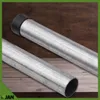 Two galvanized metal pipes are shown on a wooden surface. One pipe has a black cap on one end. Produktbild-Vorschau