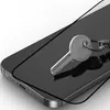 A close-up shot of a smartphone screen protector with a key on it. Náhled obrázku produktu