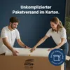 A man and a woman are unrolling a mattress from a large cardboard box. Produktbild-Vorschau