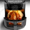 A close-up shot of an air fryer with a roasted chicken and vegetables inside, showcasing its interior and digital display. Produktbild-Vorschau