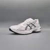 A single white and black ASICS sneaker is shown from the side against a plain gray background. Produktbild-Vorschau