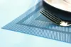 A close-up of a placemat with a fork and part of a plate on it. Podgląd zdjęcia produktu