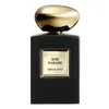 A black bottle of Armani Privé Rose D'Arabie Eau de Parfum Intense with a gold cap. Voir les images du produit