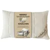 A cream-colored pillow with a label showing product details. Produktbild-Vorschau