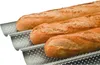 Three baguettes are placed in a perforated baking tray. Náhled obrázku produktu