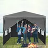 People enjoying themselves under a party tent with a campfire nearby. Náhled obrázku produktu