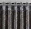 A close-up view of dark gray curtains hanging from a silver rod. Produktbild-Vorschau