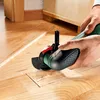 A person is using a power tool to cut into a wooden floor. Voir les images du produit