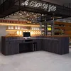A counter in a cafe or shop, with shelves displaying products behind it. Voir les images du produit