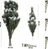 Two artificial Christmas trees of different sizes, with snow-like flocking, and measurement indicators. Náhled obrázku produktu