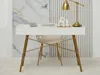 A white desk with gold legs, a chair, and decorative items on top, set against a marble and ribbed wall. Voir les images du produit