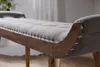 Close-up of a tufted upholstered bench with a wooden frame and metal studs. Produktbild-Vorschau