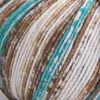 A close-up view of a ball of yarn with multiple colors. Podgląd zdjęcia produktu