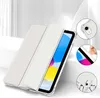 A white tablet case with a clear back is shown with a tablet inside, angled diagonally. Insets show close-ups of the case's features. Anteprima dell’immagine prodotto