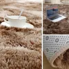 A collage of images showing a fluffy brown rug with a cup and saucer, a laptop, and the underside of the rug. Náhled obrázku produktu