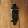A close-up view of a USB charging port integrated into a wooden surface. Náhled obrázku produktu
