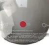 A close-up of a helmet with text and a red dot. Podgląd zdjęcia produktu