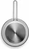 The underside of a stainless steel frying pan with a handle, presented on a white background. Produktbild-Vorschau