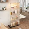 A modern display cabinet with shelves and glass doors, illuminated by LED lights, showcasing various decorative items and books. Náhled obrázku produktu