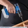 A person is using a cordless drill to screw into a piece of wood. Produktbild-Vorschau