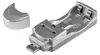 A silver USB battery charger with two slots for batteries and a detached cap. Produktbild-Vorschau