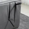 A close-up view of the underside of a dark gray sofa, showing its legs and fabric. Podgląd zdjęcia produktu