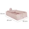 A pink baby lounger with bunny ears and a face. Produktbild-Vorschau
